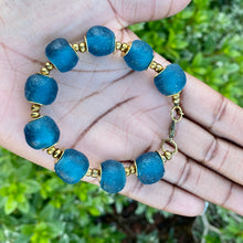 Load image into Gallery viewer, Teal Recycled Glass Bracelet: Sustainable, eco-friendly jewellery featuring exquisite teal beads. Handcrafted from recycled glass, adjustable for versatile styling. Embrace ethical fashion with this vibrant and environmentally-conscious accessory.