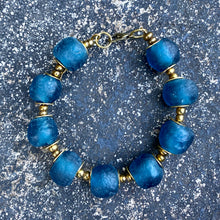 Load image into Gallery viewer, Teal Recycled Glass Bracelet: Sustainable, eco-friendly jewellery made from upcycled glass beads in a captivating teal hue. Adjustable design for versatile styling. Embrace ethical fashion with this striking and environmentally-conscious accessory.
