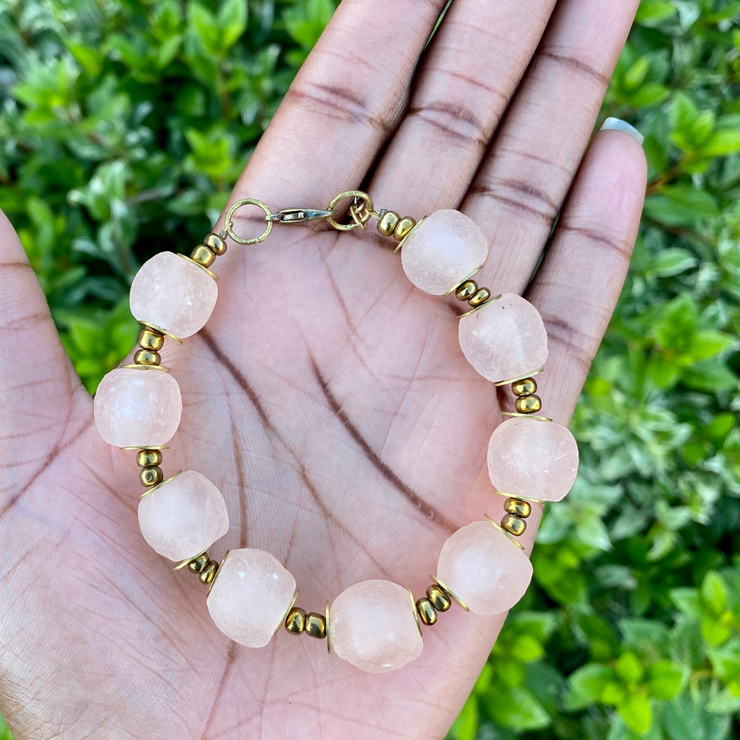 Blush Pink Recycled Glass Bracelet: Sustainable and stylish eco-friendly jewellery made from recycled glass, showcasing a delicate blush pink hue. Adjustable design for a comfortable fit. Perfect for ethical fashion enthusiasts. Shop now for a greener accessory