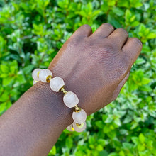 Load image into Gallery viewer, Blush Pink Recycled Glass Bracelet: Handcrafted eco-friendly jewellery made from recycled glass. Delicate pink beads on a wrist. Sustainable fashion accessory.
