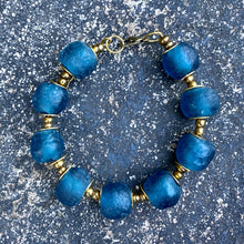 Load image into Gallery viewer, Teal Recycled Glass Bracelet: Sustainable, eco-friendly jewellery made from upcycled glass beads in a captivating teal hue. Adjustable design for versatile styling. Embrace ethical fashion with this striking and environmentally-conscious accessory.

