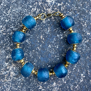 Teal Recycled Glass Bracelet: Sustainable, eco-friendly jewellery made from upcycled glass beads in a captivating teal hue. Adjustable design for versatile styling. Embrace ethical fashion with this striking and environmentally-conscious accessory.